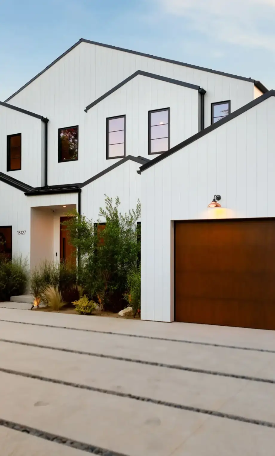 modern-white-house-with-wooden-garage-2025-02-10-06-52-06-utc